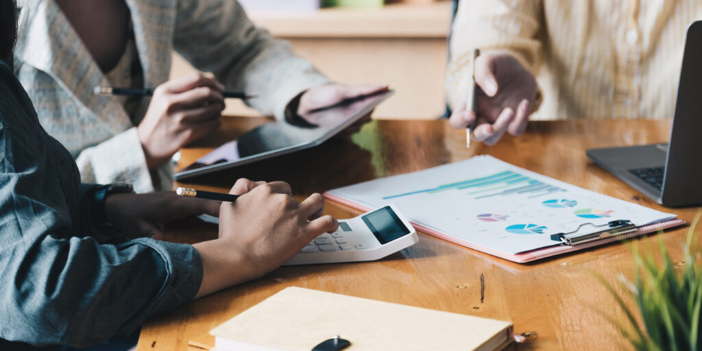 Group of business people are meeting to analyse business data